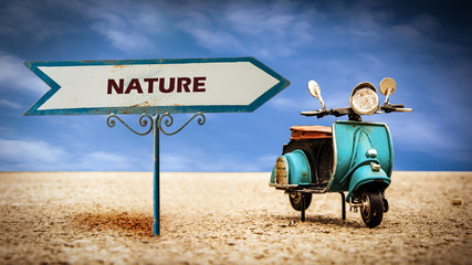 Naklejka premium Street Sign to Nature