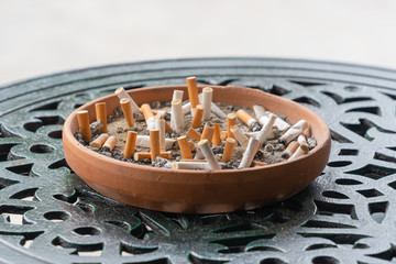 Cigarette butts that have been smoked in an ashtray