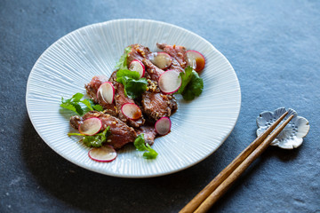 Japanese style beef tataki with radish and coriander