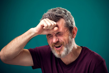 Fototapeta premium A portrait of sad bearded man. People and emotions concept