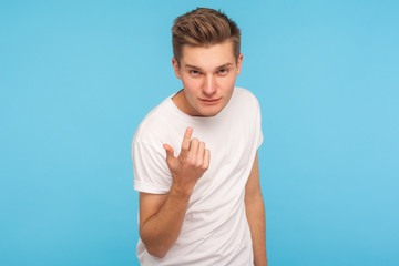 Come to me! Portrait of handsome man in casual white t-shirt making beckoning gesture and looking...