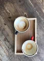 cup of coffee on wooden table