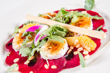 Beetroot carpaccio with goat cheese