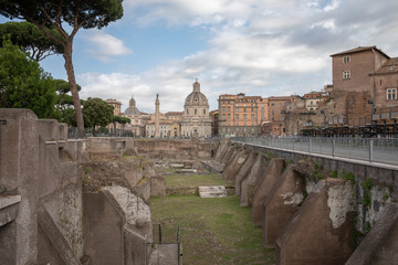 Obraz premium Panoramic view of Trajan's Forum and Column in Rome, far away the Church