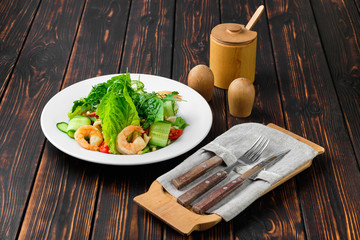 Lenten salad with shrimps, squid, cucumber, tomato and pine nut