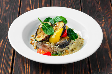 Roasted aubergine with bell pepper, green buckwheat, pine nut and pumpkin seed