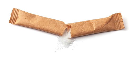 Sugar stick torn in half. Sugar in paper kraft packaging. Mock up for design isolated on white...