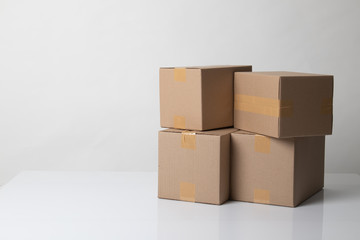 Pile of various size taped up  cardboard boxes