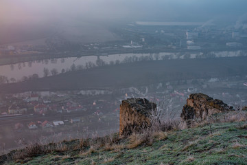 Sunrise time on Radobyl hill over valley of river Labe and Litomerice town