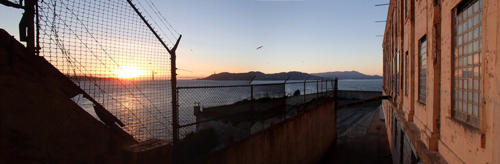 Golden Gate bridge as viewed from behind Alcatraz fence. Dreaning of Freedom