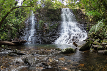 Naklejka na ściany i meble Twin waterfalls in Wet Tropics World Heritage Rainforest. 