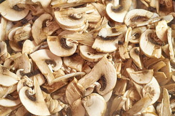 Close up fresh half sliced mushroom - champignon