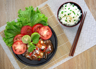 Spicy fish Canned Sardines Salad in black color dish and rice in black bowl (Thai food) but arrange dishes style Japanese