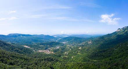Amazing view of the landslide on a mountain road near Naqerala Pass and Cxrajvari mountain. Serpentine road and and view of the city of Tkibuli. Georgia