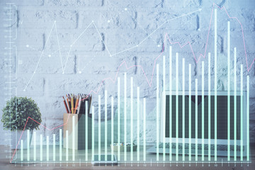 Double exposure of chart and financial info and work space with computer background. Concept of international online trading.