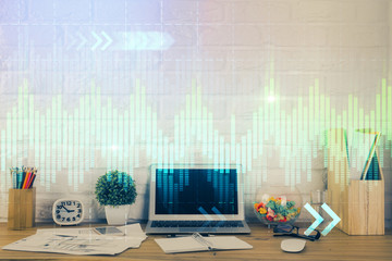 Financial graph colorful drawing and table with computer on background. Multi exposure. Concept of international markets.