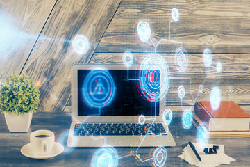Double exposure of desktop computer and technology theme hologram. Concept of software development.