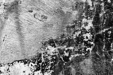 Texture of a concrete wall with cracks and scratches which can be used as a background