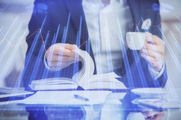 Double exposure of businessman with coffee with stock market forex chart.