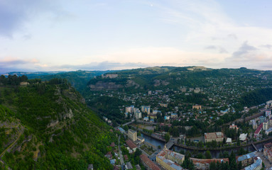 The city of Chiatura located in the gorge of the Kvirila River, a tributary of the Rioni and on adjacent plateaus. Panorama of the city district and Upper cable car station Perevisa.