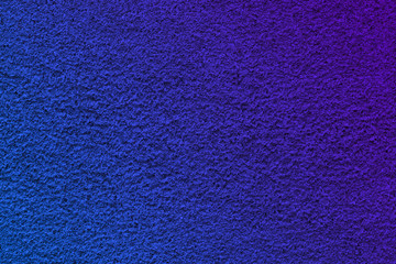 Texture photo of decorative stucco wall of a house. Background with a blue gradient for the designer.