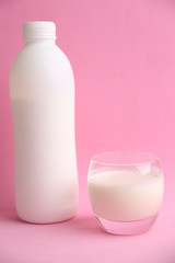 liquid yogurt bottle in color background