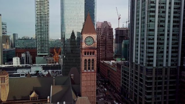 The Historic Clock Tower Of Toronto Old City Hall Surrounded By High-Rise Towers In Nathan Phillips Square, Canada - panoramic Shot
