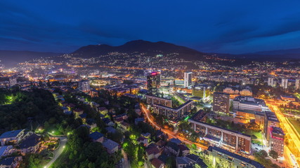 Aerial view of the southern part of Sarajevo city day to night timelapse.