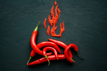 Red hot capsicum with paprika scattered in the form of flame petals