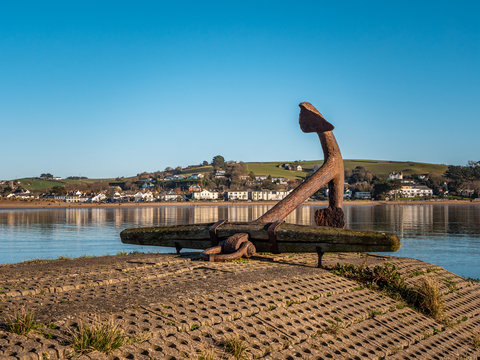 Large anchor in Appledore, North Devon, UK. Seafront, blue sky, looking out from the bay on a very sunny day. 