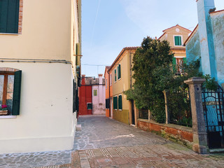 BURANO, ITALY - JANUARY 20, 2020: Colorful houses on the island of Burano in Italy. Burano island is famous for its colorful fisherman's houses..