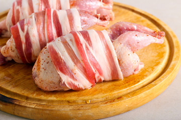 Raw Quail wrapped in bacon