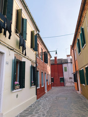 BURANO, ITALY - JANUARY 20, 2020: Colorful houses on the island of Burano in Italy. Burano island is famous for its colorful fisherman's houses..