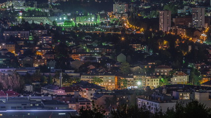 Fototapeta na wymiar City panorama from Old Jewish cemetery night timelapse in Sarajevo