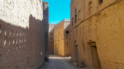 Fototapeta na wymiar Streets of Abandoned Old Ruined Village of Al Hamra near Nizwa, Oman