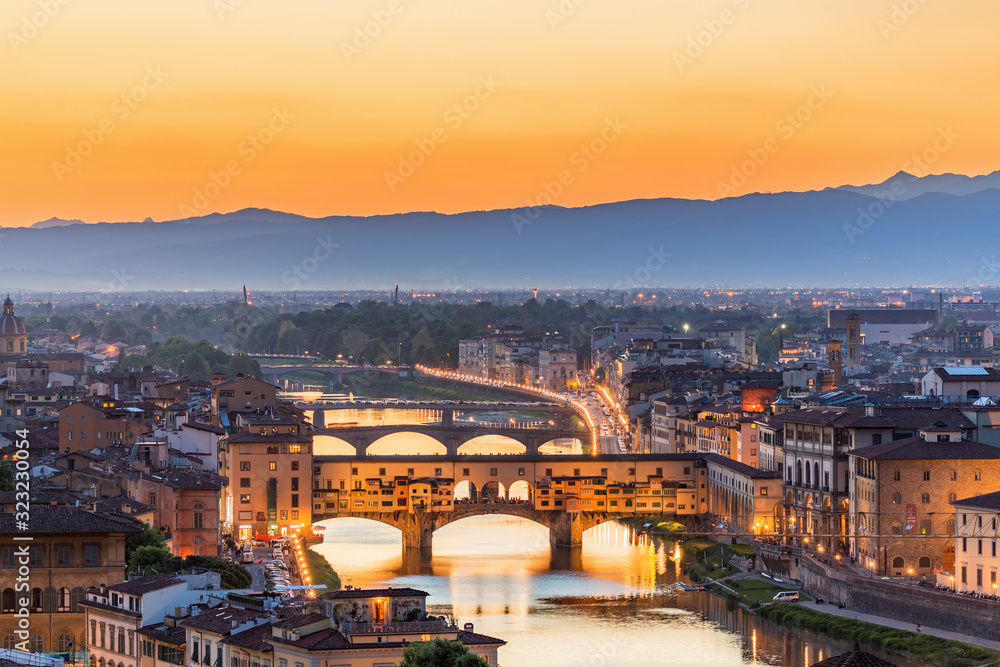 Poster View of Florence at sunset with the Ponte Vecchio bridge over the Arno River