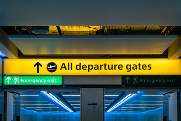 Departure gate sign in airport hall