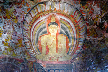 Buddha painted inside Dambulla cave temple on February 8, 2020 in Dambulla, Sri Lanka. Cave III Maha Alut Viharaya. Major attractions are spread over 5 caves, which contain statues and paintings.