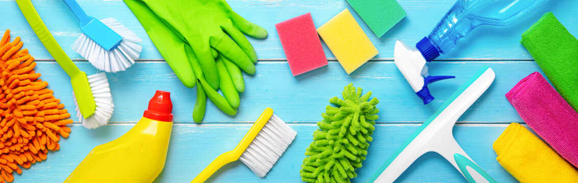 Colorfull cleaning items on blue wooden