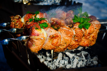 Pork skewers on skewers, cooked on the grill. Background for cooking on an open fire.