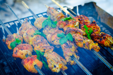 Pork skewers on skewers, cooked on the grill. Background for cooking on an open fire.