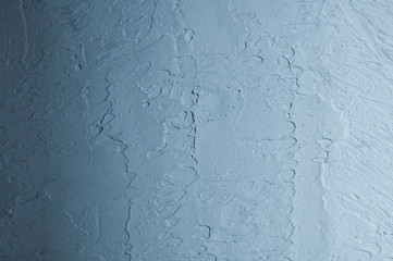 Texture of a rough blue surface. Decorative putty