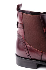 Partial details of burgundy high-top leather shoes