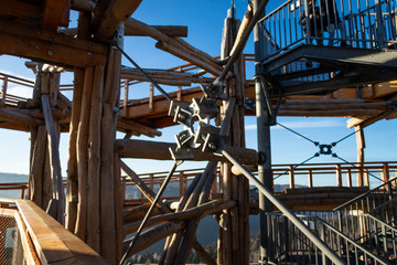 Naklejka premium wooden construction with snow and ice on it at sunyy day 