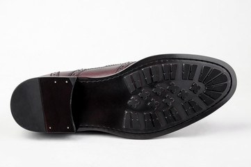 Close-up shot of leather shoe sole shot on white