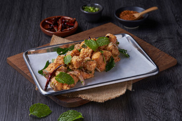 Spicy minced salmon cooking with sweet basil mixing with chilli.