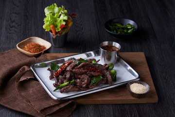 Meat fried with Thai basil cooking spicy pepper serve with cup of salad.