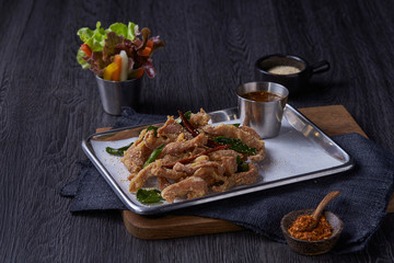 Meat fried with Thai basil cooking spicy pepper serve with cup of salad.