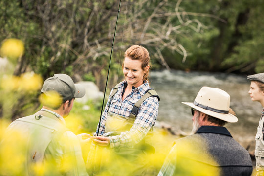 Couple learning to fly fish with guide. Red Lodge, Montana, USA