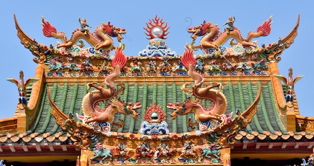 Colorful dragon statues on the roof of a Chinese temple in Penang, Malaysia